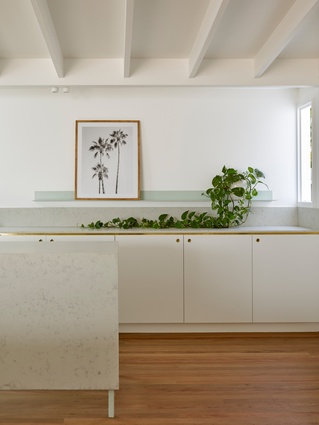 The newly reconfigured kitchen celebrates the modest scale and detail of its predecessor.