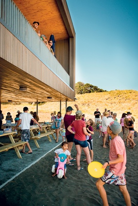 With its stunning view out to sea, the upper floor floats over the southern end of the main building and the overhang provides shelter for BBQs and gatherings.