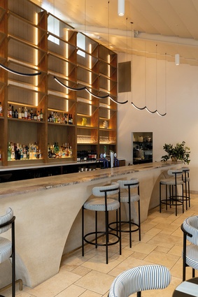 Placing louvred windows above the existing apertures behind the bar area maximises natural light throughout the space.