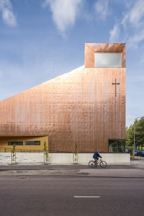 The copper-clad Suvela Chapel by OOPEAA, 2016. A flexible, multifunctional building that welcomes all members of the community, regardless of their religious affiliation.
