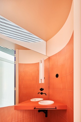 Colour-rich: A bold pop of orange contrasts nicely against bright blue in this small Madrid bathroom in Casa A12 by Lucas Y Hernández-Gil. The architect detracts from the space’s tight constraints via a confident use of colour, making it appear larger than what it actually is.