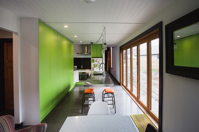 The lime green kitchen cabinetry, while not for everyone, adds vibrancy to the house.