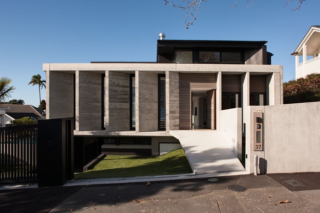 Precast concrete louvers replace the traditional front porch on the updated 'villa' by achitect Daniel Marshall. 