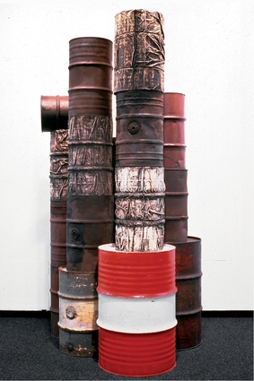 Wrapped Oil Barrels, 1958–1959, by Christo. 