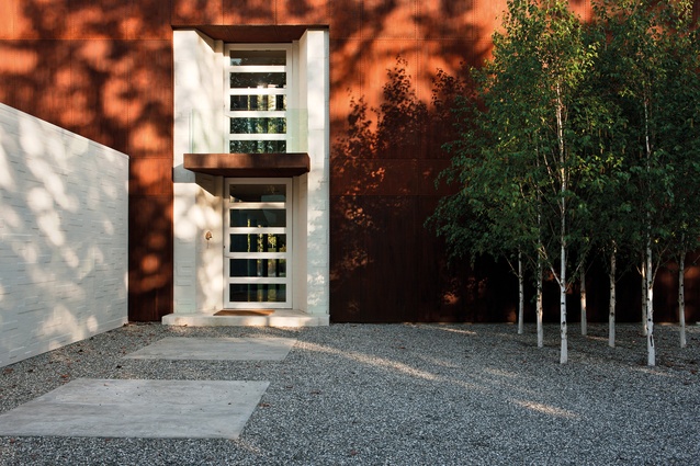 Two groups of silver birch, gathered in a gridline formation, are simple, vertical elements within the courtyard.