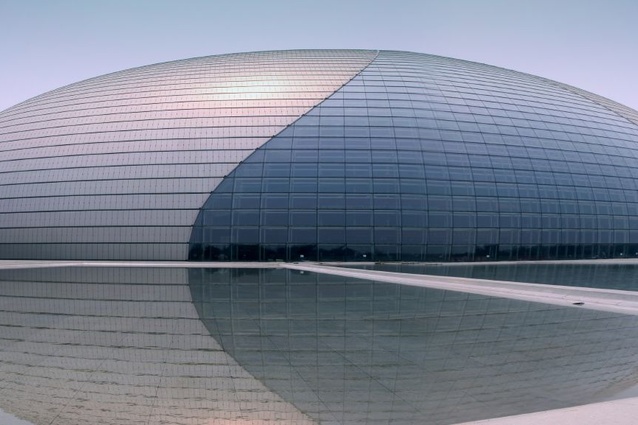 Beijing National Grand Theatre by Paul Andreu. The titanium shell is divided in two by a curved glass covering and during the day, light penetrates through the glass roof.