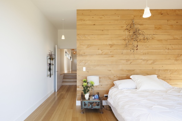 Exposed timber in the master bedroom and family bathroom creates texture and warmth. 