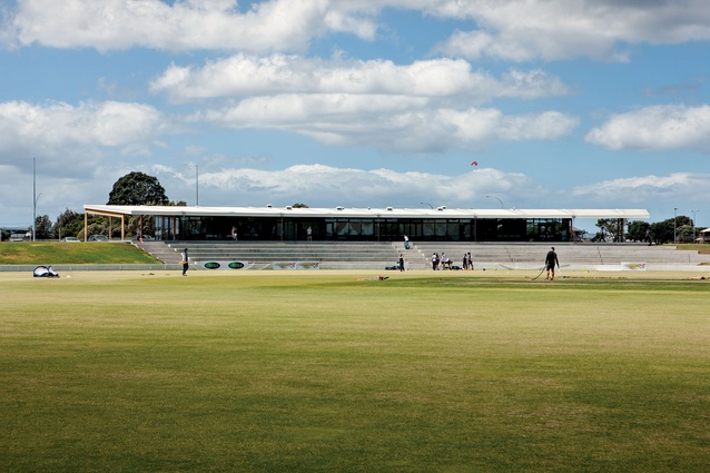 The Bay Oval cricket pavilion uses a regular repeating structure with a material palette of cast concrete, glulam timber and glazing to keep the building cost relatively low. 