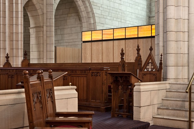 The chapel’s vertical oak paneling contrasts with the horizontal stone coursework.