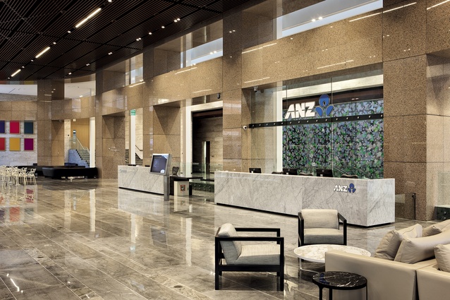 The ANZ reception, with Florida limestone reception desk. The existing cladding of the building, which was retained, is a reddish-pink stone called Rosso Porrino.