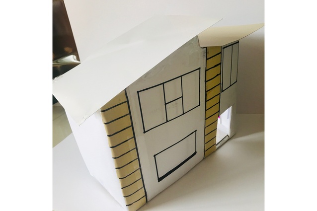 Finalist: Mali (age 13) – "A modern, art-filled dream home. Mali has created a spiral bookcase, a cosy floral sofa with plenty of through pillows and her dream swing chair." Made from recycled boxes, tape and vivid.
