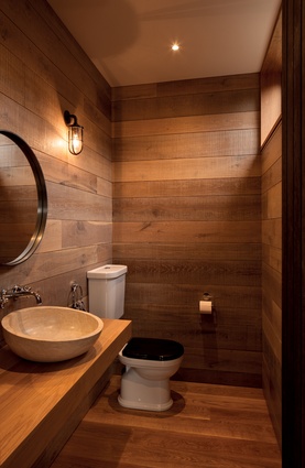 The bathroom is lined in raw-sawn timber. 
