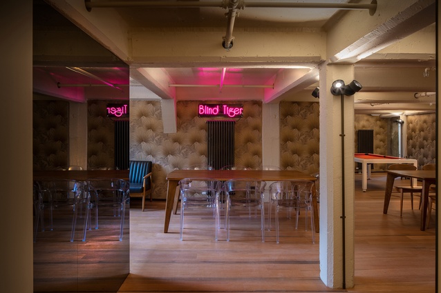 The Blind Tiger, once an underground speakeasy bar, has been turned into a ’70s-themed recreational space, complete with neon signage and a pool table.