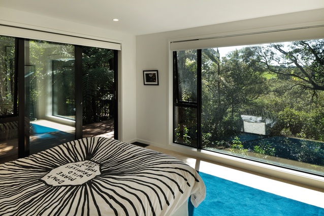 The master bedroom looks over the mangroves. 