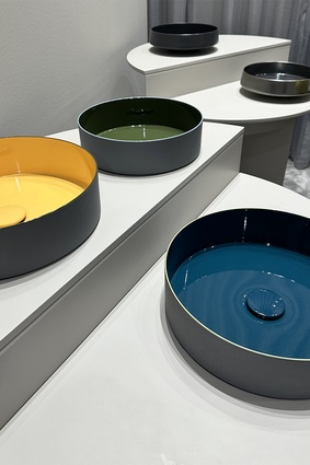 Alape’s ceramic basins enclosing a bright pop of colour.