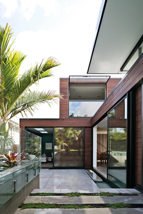 Misaligned House: Narrow pools impart a tropical feel, adding drama to the courtyard through water’s reflective quality.