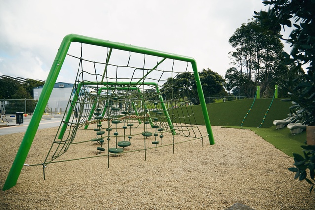 A bespoke climbing net is the central focus of the playscape, reinforcing references to field sports. 
