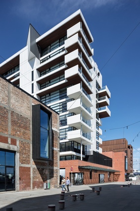 Three rows of apartment types: nine floors of units in the concrete artisan block, the three storey brick mews and the five levels of timber pavilions.