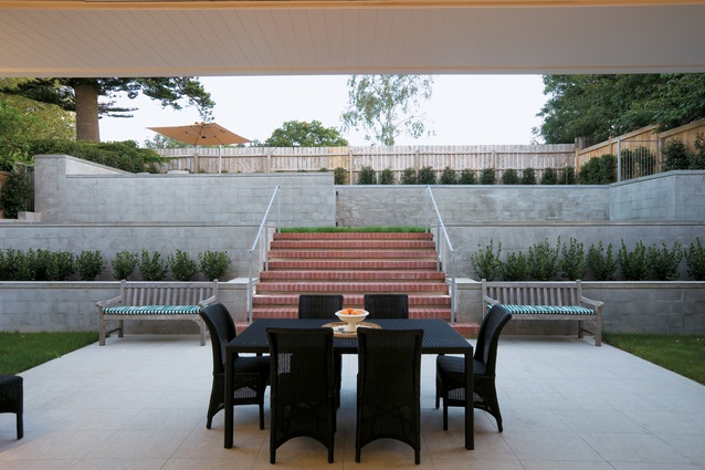 A patio now extends out towards the terraced back landscape.  