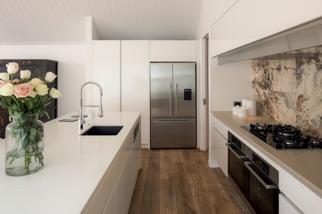 In keeping with the modern classic theme, natural materials such as the French oak flooring and stone tile splashback provide an organic element. 