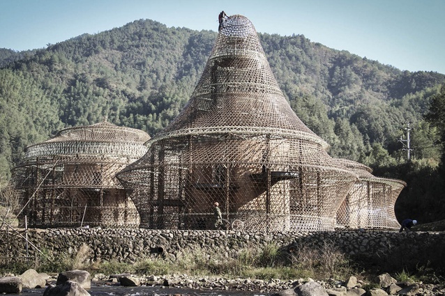 Bamboo Hostels, China. The round buildings feature a open bamboo structure, woven like a basket around a solid core of rammed earth and stone.