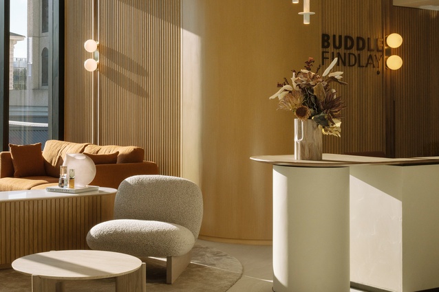The welcoming reception, its homely quality emphasised by the soft textures and warm colour palette. 