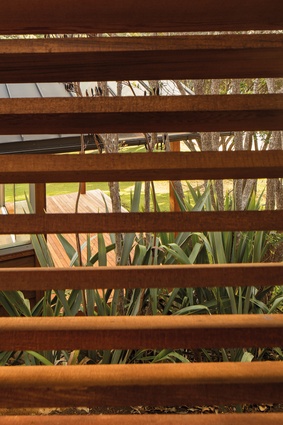 Timber louvres filter the light and maintain privacy.

