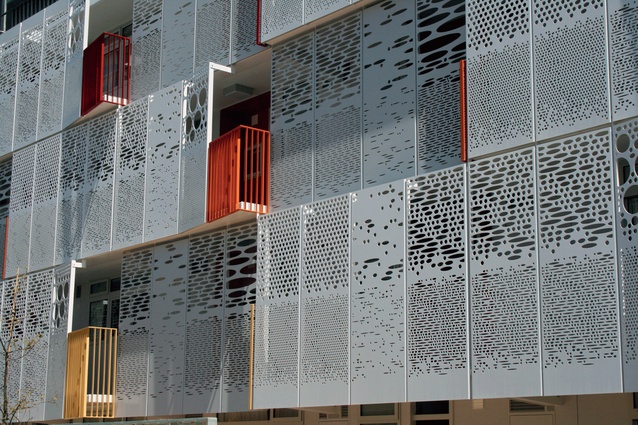 A new facade is made of perforated steel panels.