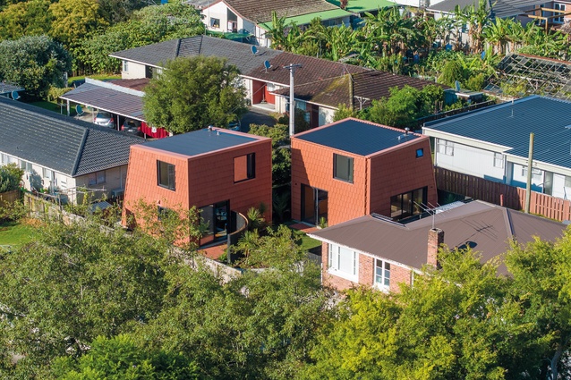 Pocket Houses at Avenue Road in context with units, brick and tiles, and abandoned greenhouses in Ōtāhuhu. 