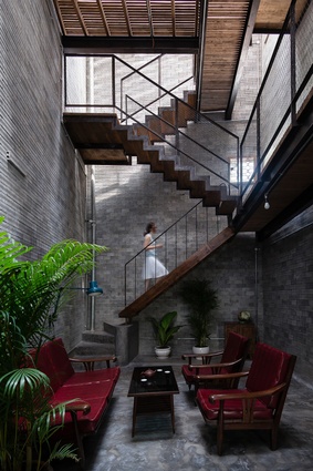Zen House, Ho Chi Minh. Light enters the house through small windows built into the brick wall that creates shadow patterns and brings a sense of peaceful sanctuary.