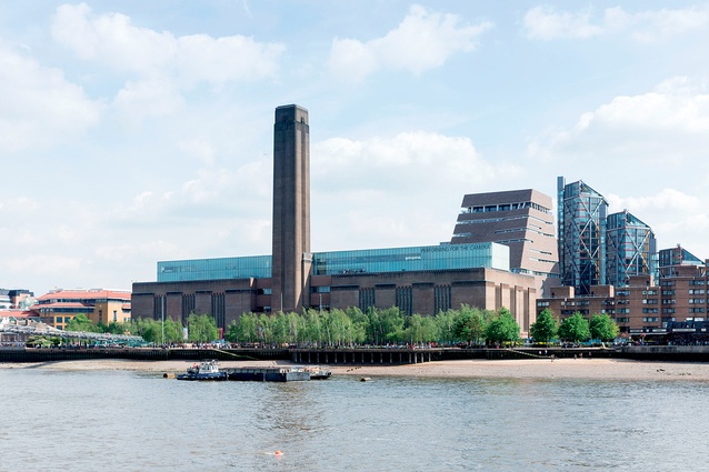 The new Switch House extension rises up behind the Tate Modern, which was originally designed as a power station in the 1950s.  

