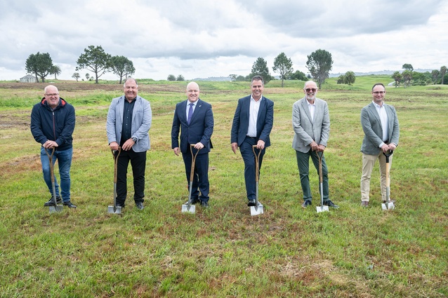 Spades at the ready at the Beachlands sod-turning for the development of a multi-billion dollar scheme. From left: Billy Brown of Ngāti Tai ki Tāmaki, Rob Bassett of Bassett Plumbing & Drainage, Prime Minister Christopher Luxon, Brett Russell of Russell Group, Mayor Wayne Brown, and Will Goodwin of the NZ Super Fund. 