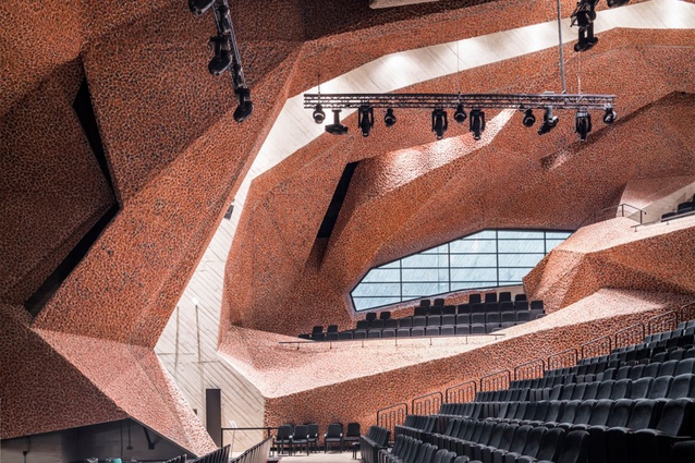CKK Jordanki auditorium, Poland by Fernando Menis. A mix of crushed red brick and concrete (a technique called picado) forms the striking interior of this concert hall, designed to provide optimal acoustics.