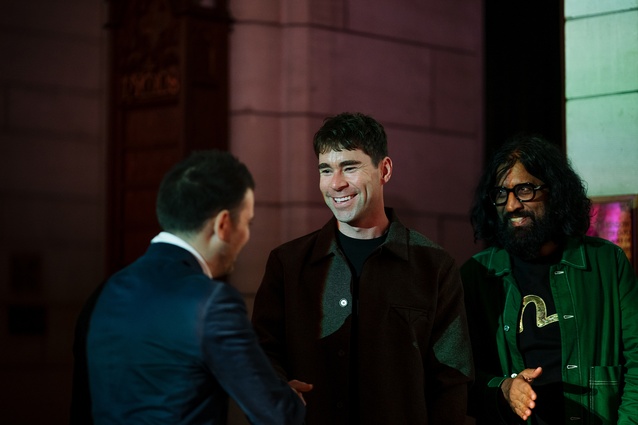 2025 jurors Sam Griffin (Ctrl Space) and Murali Bhasker (Boon) congratulate Emerging Design Professional winner, Matt Reid of Warren and Mahoney.