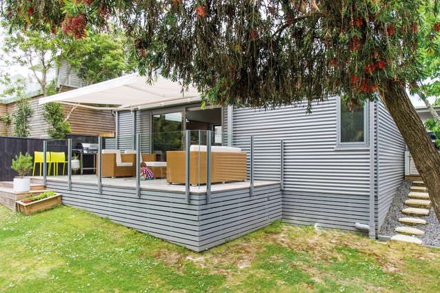 Herne Bay House. Light-grey timber carries through from the deck to the original villa.
