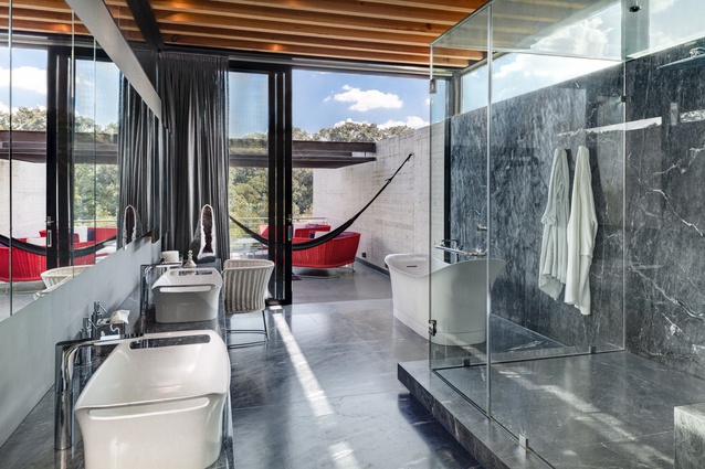 Bathrooms showcase some of the home’s luxurious, imported fittings and furnishings, including the basinet-shaped porcelain bath and basins.