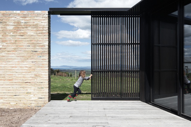 A large, steel sliding screen allows the northern deck to be used in a variety of weather conditions.
