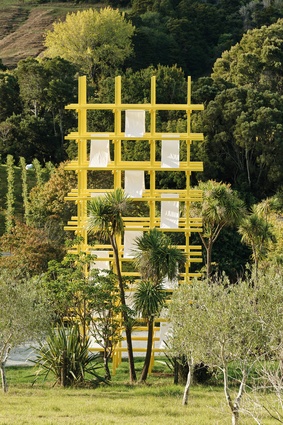 The tower of yellow punctures the landscape with its strong geometry. 