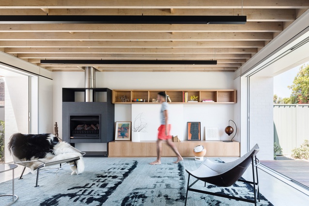 Considered spatial configuration allows for comfortable multi-generational living, as required by the clients. Artwork (L–R): Mary Teague; Michael Rose.