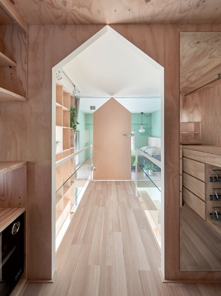 At a mere 40m<sup>2</sup>, this apartment uses clever storage and a mezzanine floor to comfortably house a family of three.