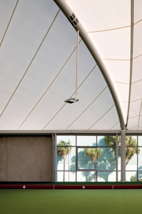 LED lighting stalks hang elegantly into the space like antennae, making the fabric structure glow at night.