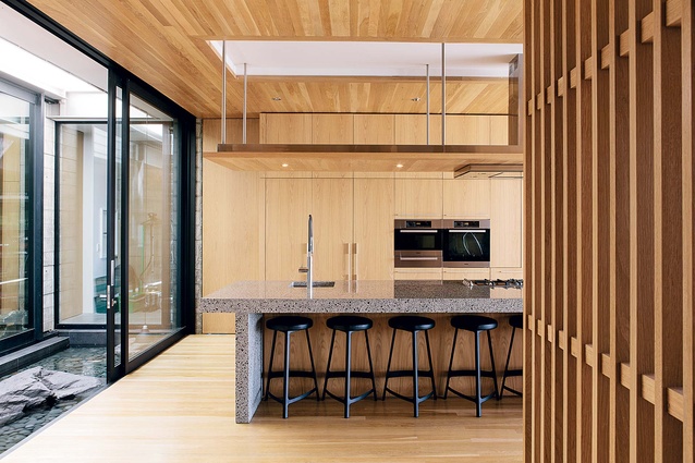 The kitchen runs the width of the open-plan living area.