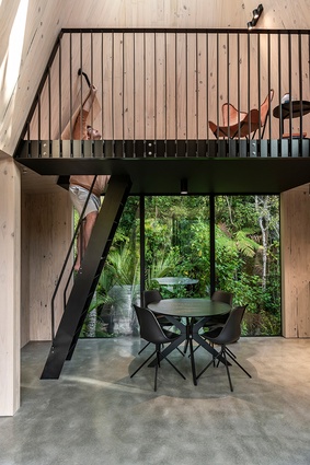 A mezzanine floor creates a second living space within the structure.