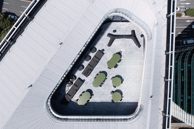 The drone shot captures the rooftop deck, safe within the oculus.