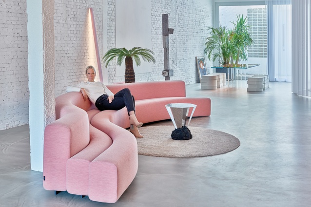 Sabine Marcelis at home. The Concrete totem behind her is by Magnus Pettersen, a Danish artist. Marcelis loves his eye for proportion and balance, as well as the totem’s material: coloured concrete.
