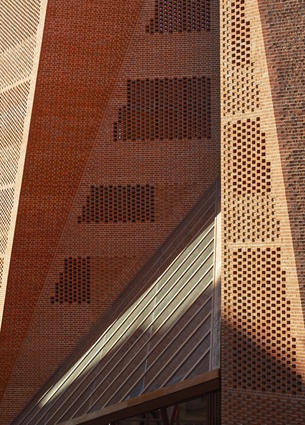 LSE Saw Hock Student Centre. Brick is used in a new way here, each offset from the next and wrapping the walls in a permeable blanket that will create changing, dappled daylight.