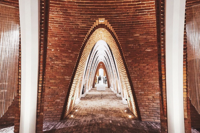 The main corridor is made up of repeating vaulted arches.