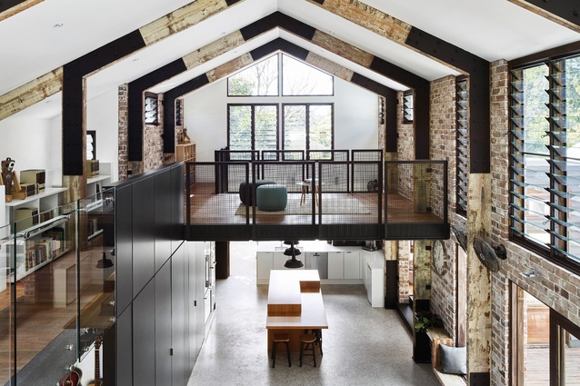 The double-height living space conforms to the gable-roofed extrusion of the barn typology.