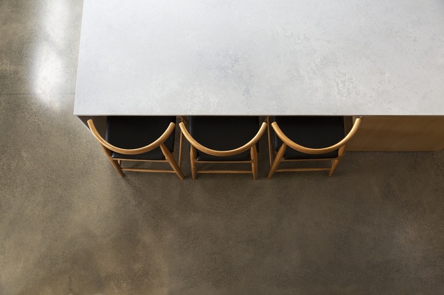 A Caesarstone Airy Concrete benchtop ties in well with the polished concrete floors.