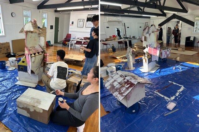 Students putting the first lick of paint on the signage models.